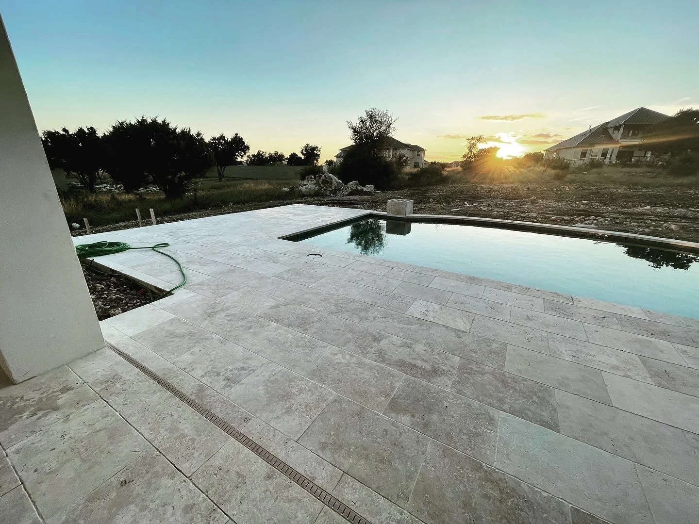 Large-format tile around a pool