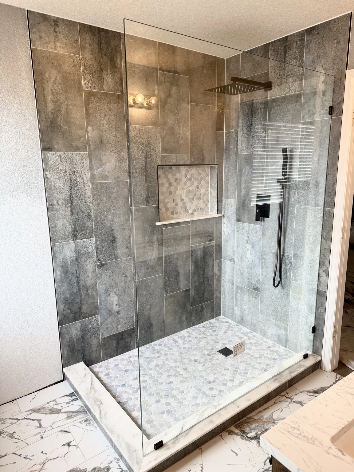 Shower with glass enclosure