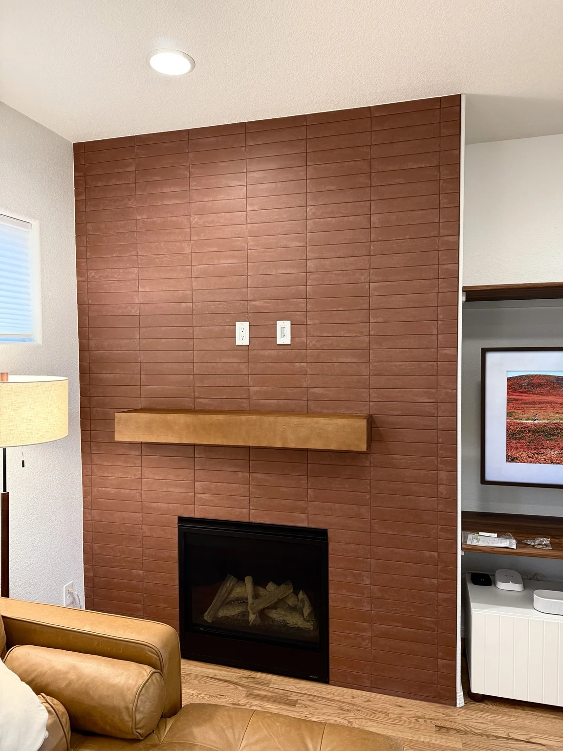 Terracotta-colored fireplace tile