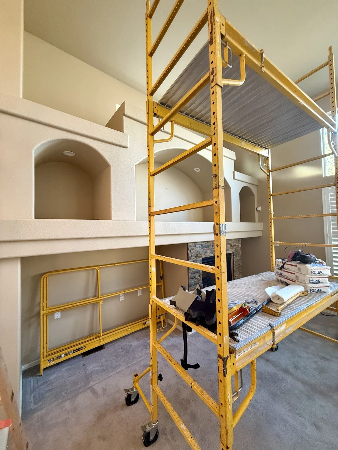 Living room wall during reconstruction with scaffolding